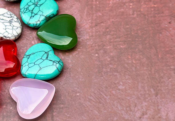 istock Colorful Heart Shaped Gemstones On Textured Background With Copy Space 2253179666