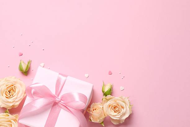 istock Beautiful composition with peony roses with gift box on pink background 2253179802