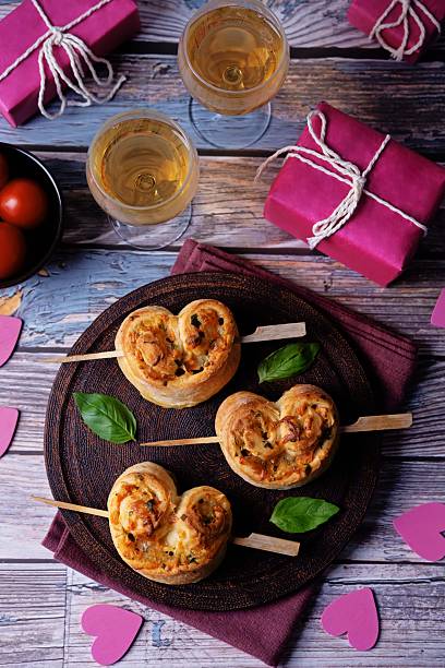 istock Basil cheese tomato puff pastry hearts for Valentine's day holidays 2253180713