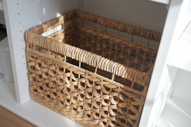 istock Woven storage basket placed on a white shelf 2253181452