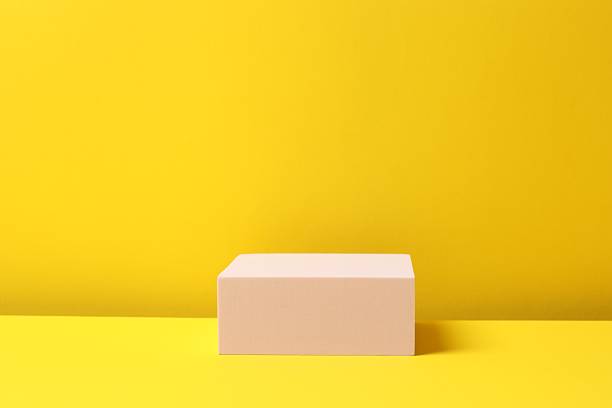 istock Pink podium on a yellow background 2253181512