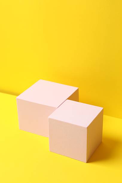 istock Pink podium on a yellow background 2253181519
