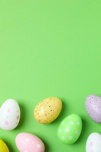 istock Happy Easter. Colorful eggs on color background, space for text or advertising 2253181531
