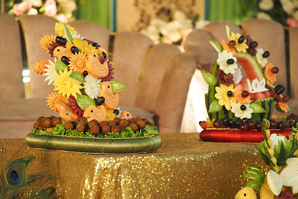 Vibrant decorations made from fruit and flowers for a festive event.