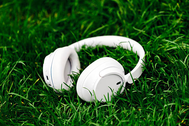 istock White wireless headphones resting on vibrant 2253185247