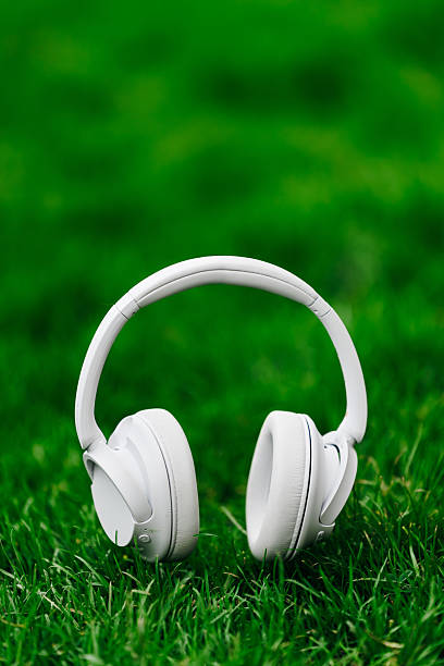 istock White wireless headphones resting on vibrant 2253185278