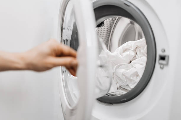 istock A woman takes out freshly washed clothes 2253185459