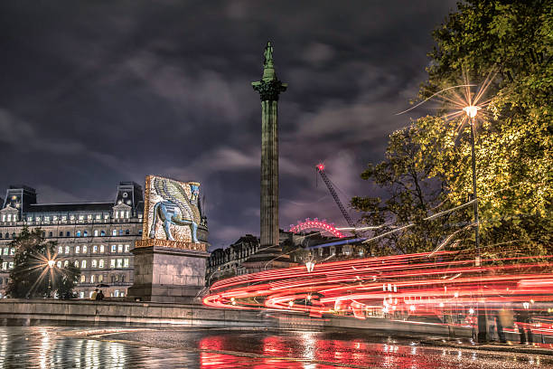 Trafalgar Square with Nelson Column at night, London, UK