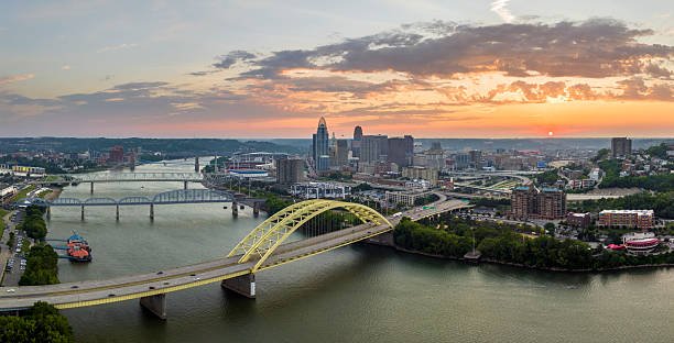 istock Highway traffic in Cincinnati, Ohio on Daniel Carter Beard Bridge with brightly illuminated high skyscraper buildings in downtown district. American city with business financial district at sunset 2253186356