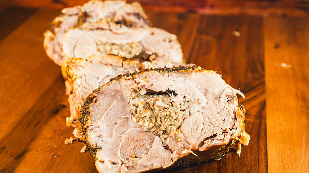 istock Sliced Stuffed Pork Joint on Board 2253186370