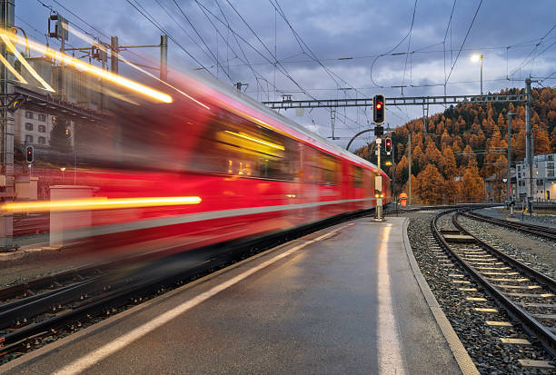 Chur, Switzerland – November 17, 2016: A closeup shot of Swiss red trains waiting on the train station in Chur, Switzerland