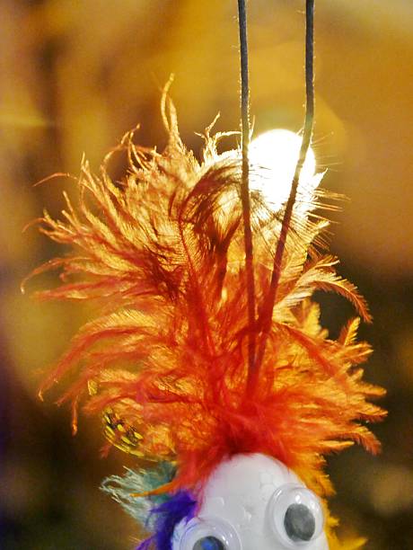 Abstract fan, white dots and feathers