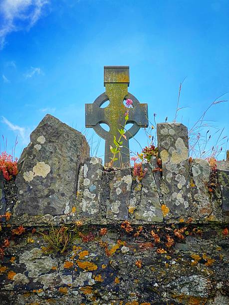 Cork County, Ireland. October 15, 2011. Group of old Celtic grave stone crosses in a waterside cemetery in rural Ireland.