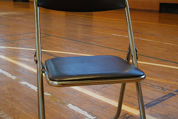 White chair stands in corner on veranda or balcony