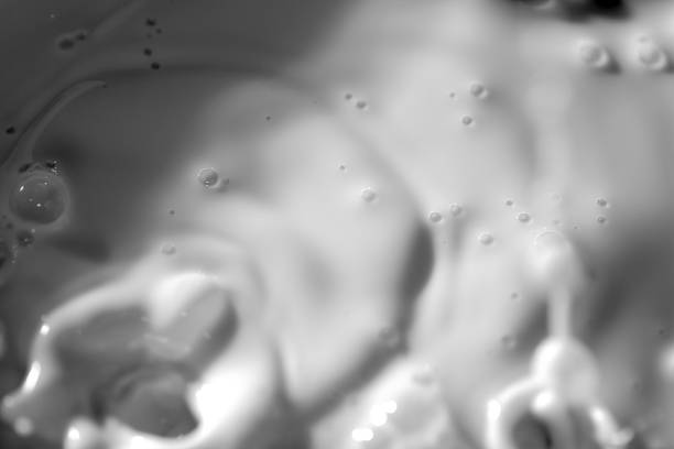 Top view of Milk splash on black and white