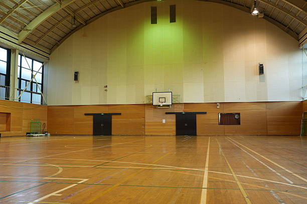 istock A basketball court is empty with a green wall 2253192123