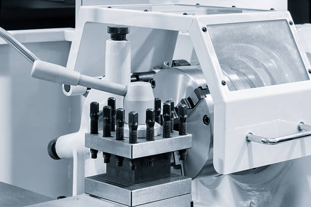 istock White lathe machine with control handles close-up, metalworking concept background 2253192481