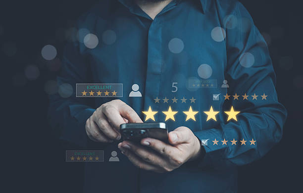 istock Customer satisfaction concept with client using smartphone to give five star rating and feedback, representing quality service, positive experience, online reviews, and brand reputation management. 2253193520