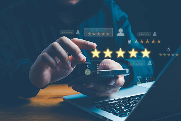 istock Customer satisfaction concept with client using smartphone to give five star rating and feedback, representing quality service, positive experience, online reviews, and brand reputation management. 2253193535