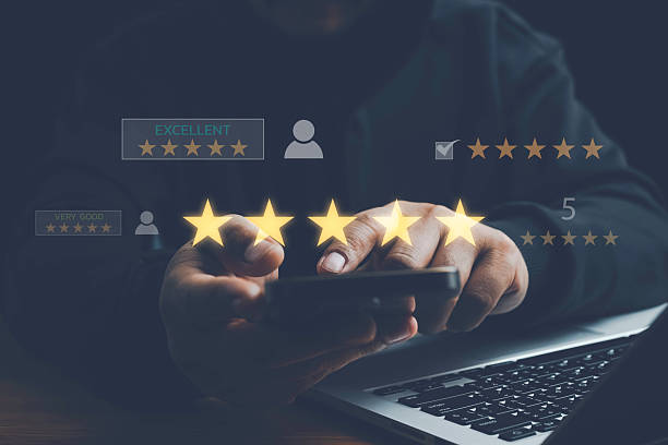 istock Customer satisfaction concept with client using smartphone to give five star rating and feedback, representing quality service, positive experience, online reviews, and brand reputation management. 2253193537
