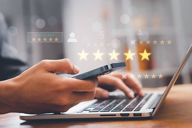 istock Customer satisfaction concept with client using smartphone to give five star rating and feedback, representing quality service, positive experience, online reviews, and brand reputation management. 2253193840