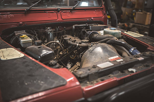 istock Close-up view of a classic car engine with the hood open in a workshop 2253193864