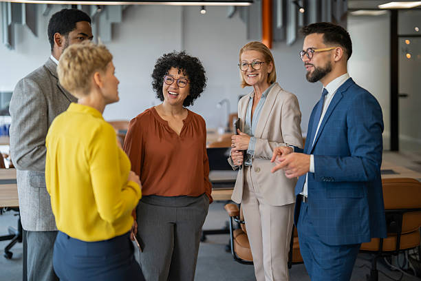 istock Cheerful business team chatting during break time in office 2253195945