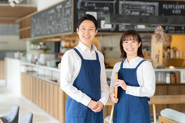 istock Male and female staff working at a cafe 2253197731