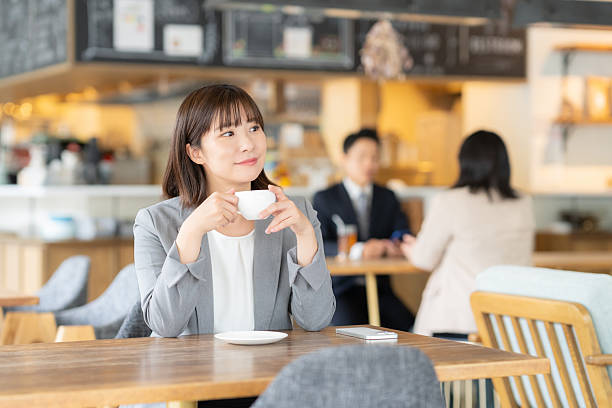 istock Businesswoman relaxing in a cafe 2253197957