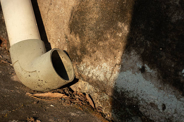 A realistic shot of urban infrastructure showing wear and tear. Ideal for construction, renovation, or plumbing maintenance content