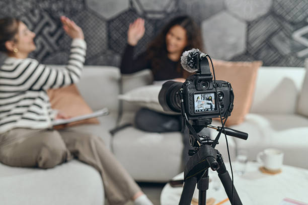 istock Host And Guest Interview Setup On Couch With Camera And Microphone In Living Room Studio 2253200014