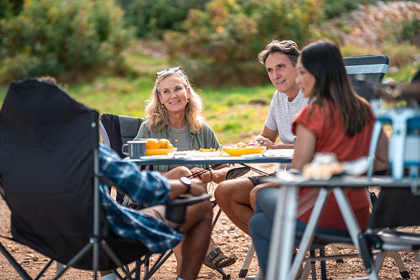 Relaxed Outdoor Breakfast Gathering With Friends Near Seaside Motorhome Camp