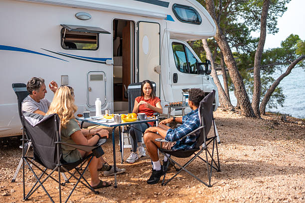 istock Diverse Adults Having Breakfast Together Outside Seaside Motor Home Today 2253201067