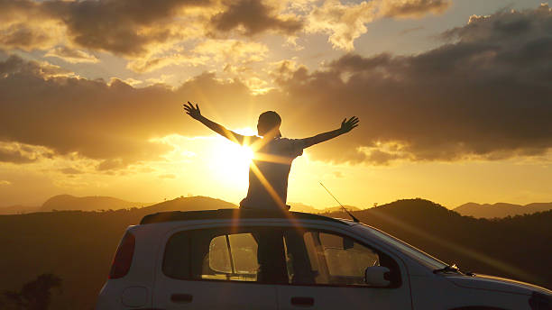 istock Happiness and Freedom During a Road Trip at Sunset 2253202988