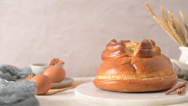 istock Sweet Braided Brioche Bread with Eggs and Cinnamon on Marble Board 2253204095