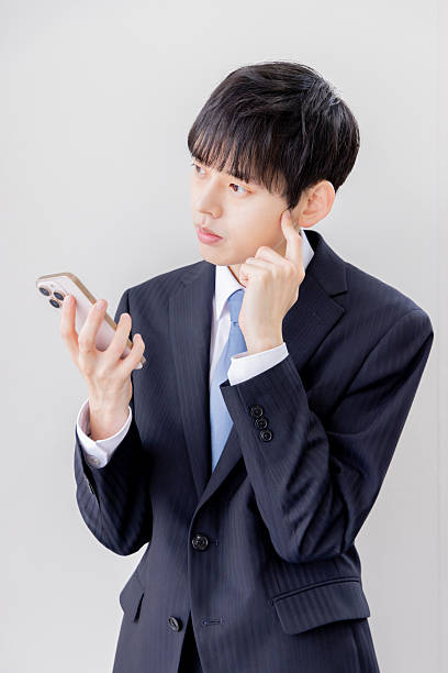 istock Businessman searching on a smartphone 2253207048