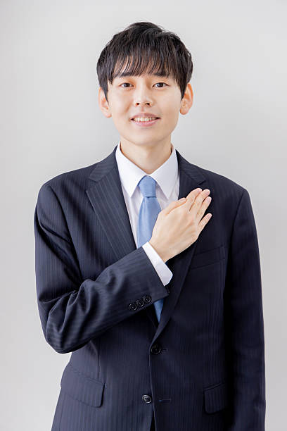 istock Young businessman with his hand on his chest 2253207049
