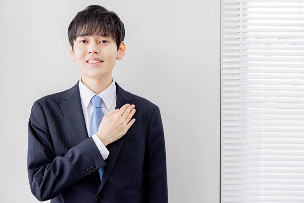 istock Young businessman with his hand on his chest 2253207051