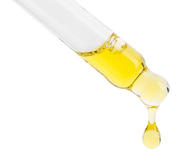 istock Dripping tincture from pipette isolated on white 2253207830