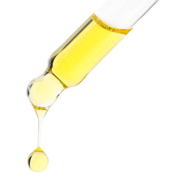 istock Dripping tincture from pipette isolated on white 2253207856