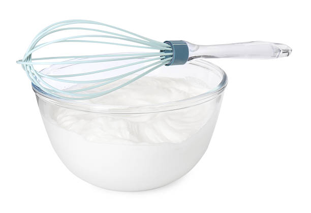 istock Bowl with whipped cream and whisk isolated on white 2253208959