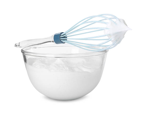 istock Bowl with whipped cream and whisk isolated on white 2253208963