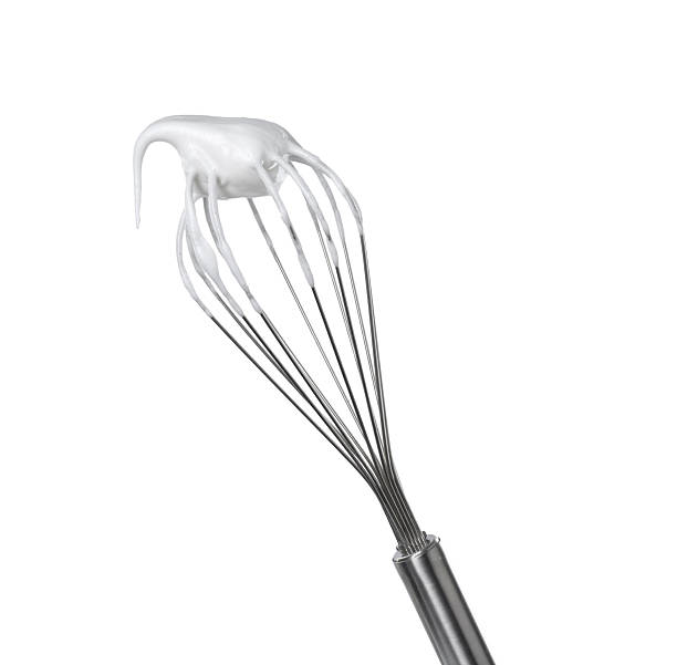 istock Whisk with whipped egg whites isolated on white 2253209038