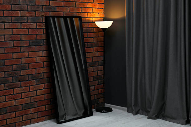 Long mirror, lamp and curtain in makeup room