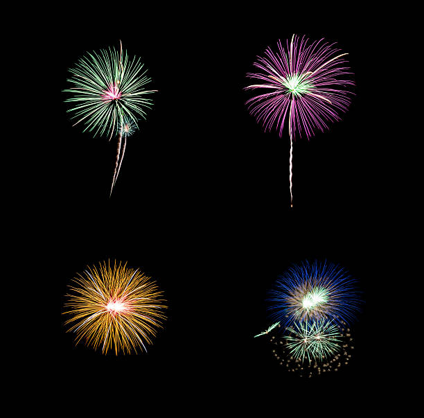 Collection of colorful festive four  fireworks exploding over night sky, isolated on black background