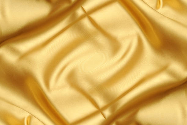 istock Crumpled gold cloth abstract background 2253215874