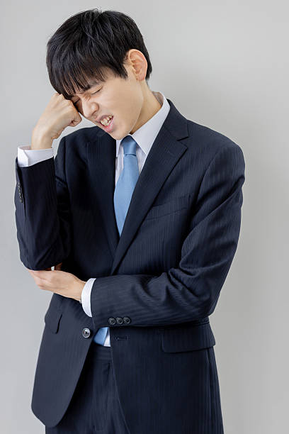 istock A young Asian businessman thinking about various things 2253217616