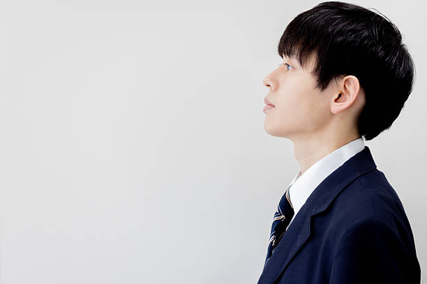 istock Portrait of a male student looking up 2253218029