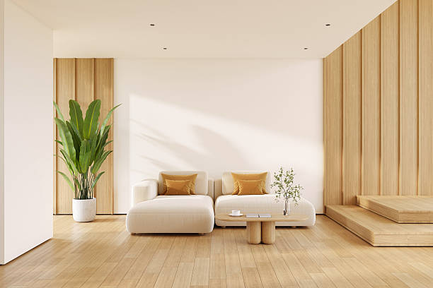 istock Modern living room interior with minimalist solf sofa, a light wood coffee table, and a tiered wooden wall, with natural light and wood floorling.3drender 2253218727