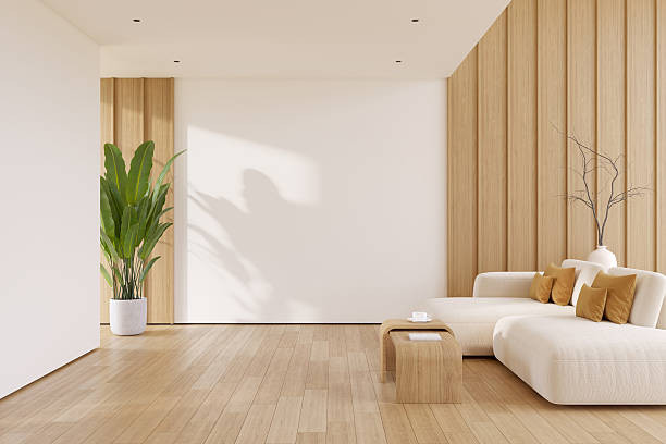 istock Modern living room interior with minimalist solf sofa, a light wood coffee table, and a tiered wooden wall, with natural light and wood floorling.3drender 2253218729